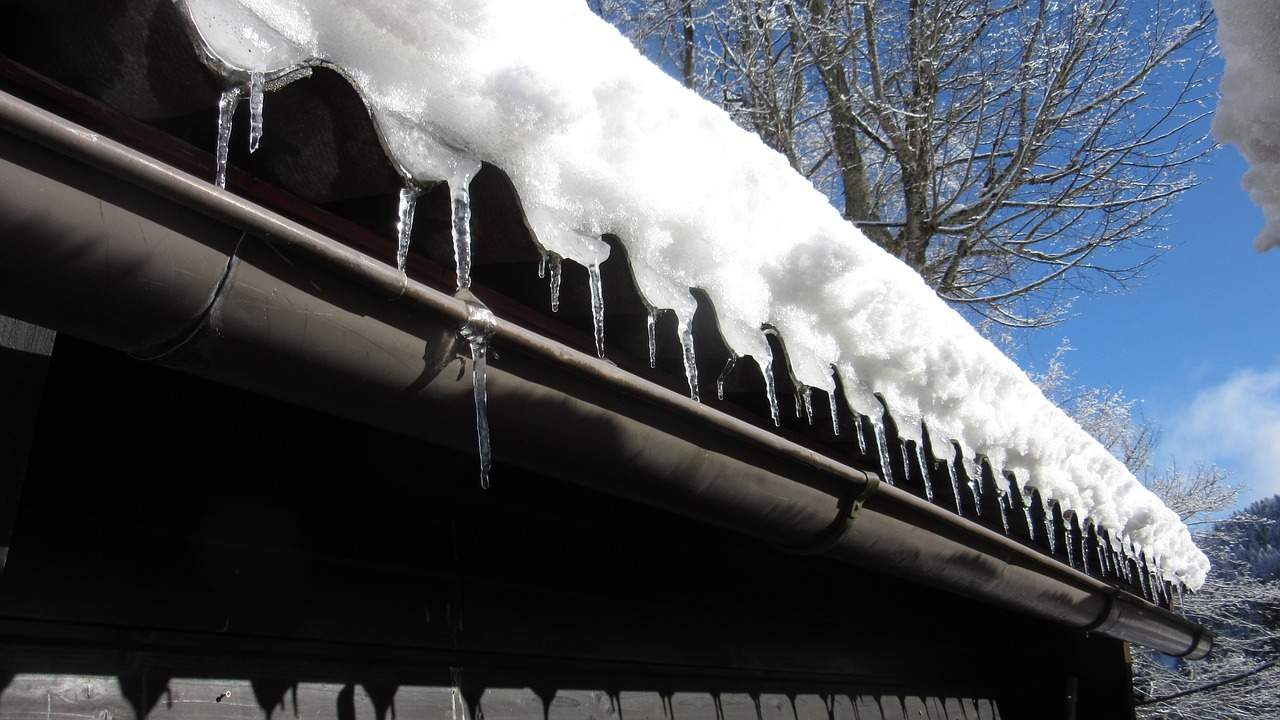 water damage caused to roof from standing snow and ice