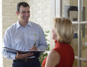 A ServiceMaster expert discussing specialty cleaning services with a client in Elgin