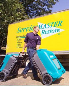 A ServiceMaster expert with water damage equipment in Ventura County