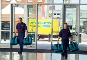 ServiceMaster technicians arriving to complete water damage restoration