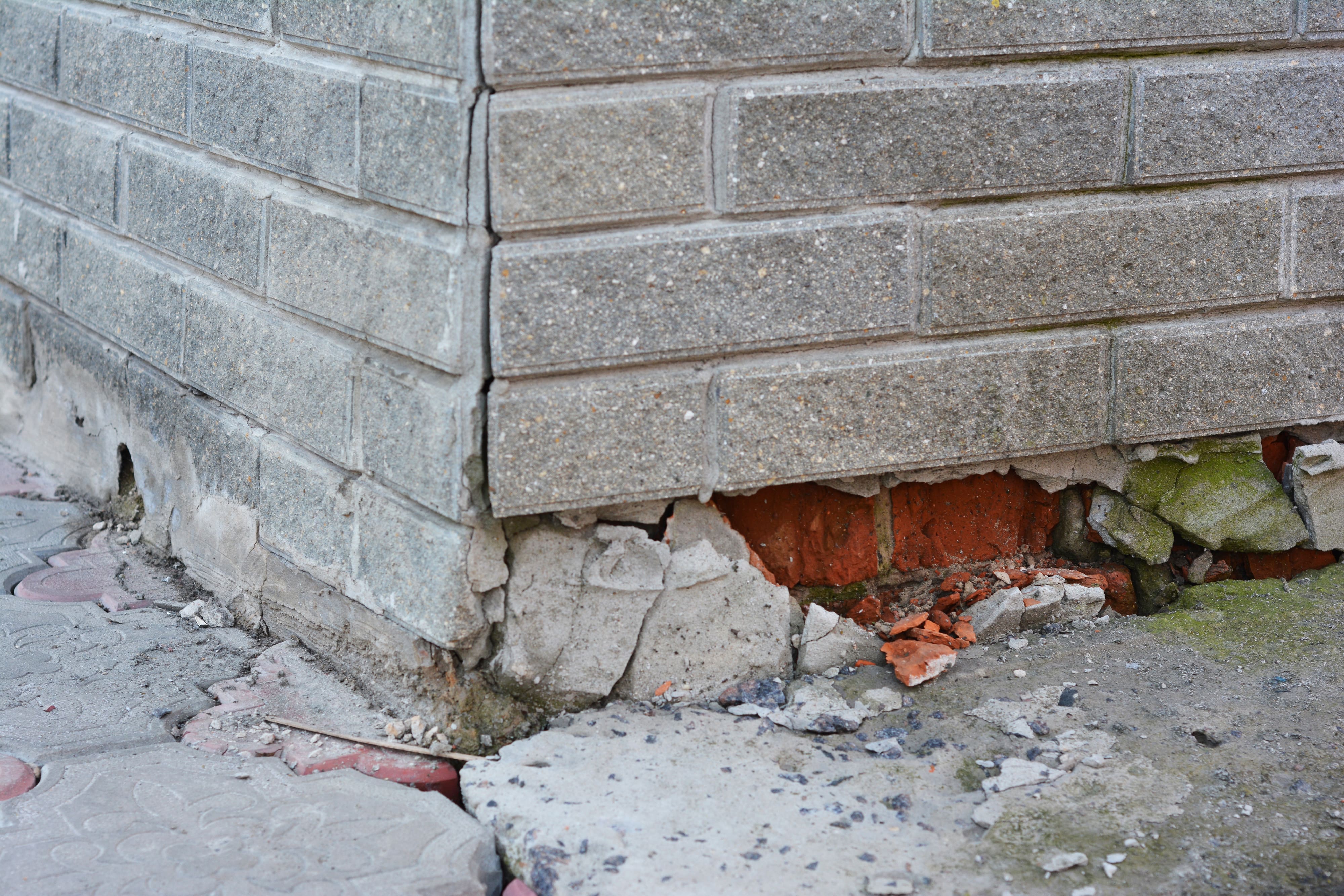 A damaged house foundation in need of water damage restoration