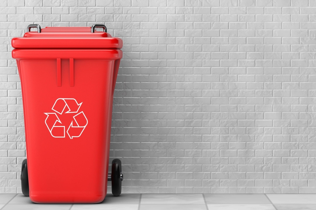 A red recycling bin