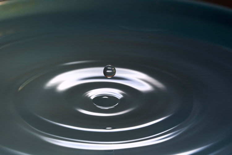Pool of water with a water drop