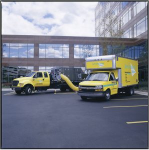 ServiceMaster trucks outside an office building