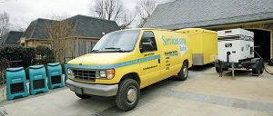 ServiceMaster van in front of house