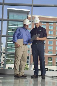 Two men in construstion hats