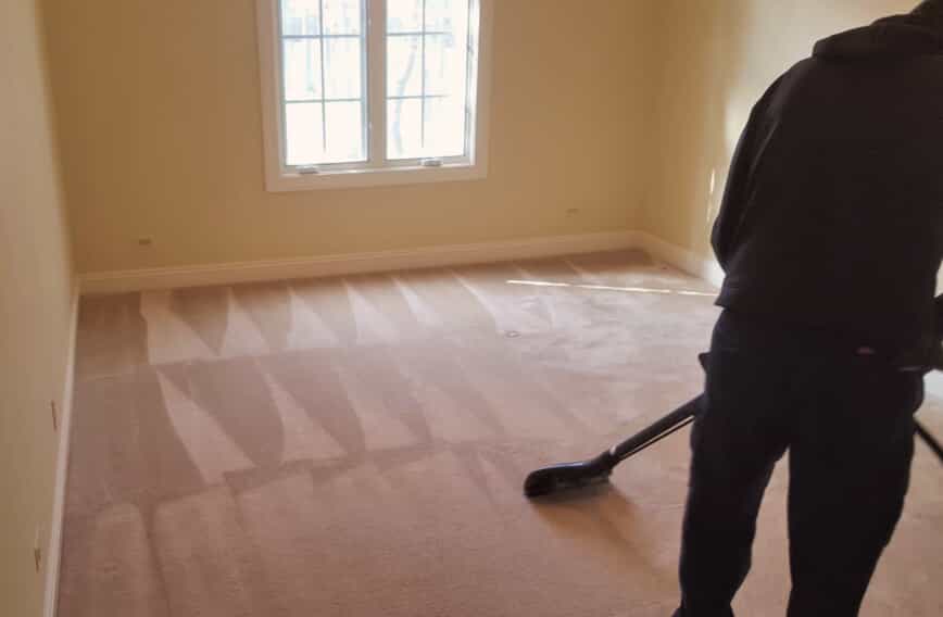 Person cleaning a carpet