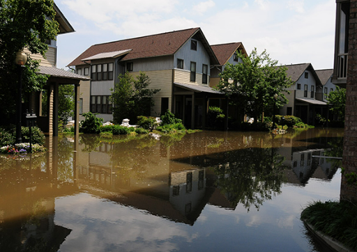 House and Street Flooded with Water