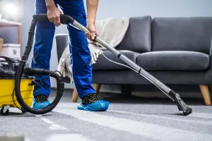 servicemaster employee cleaning carpet in home