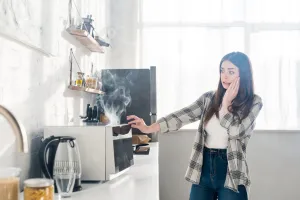 Woman Concerned Toaster Oven Smoking