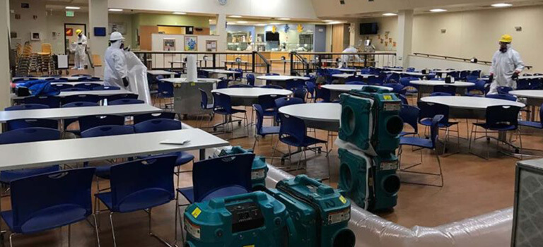Service Master staff preparing room for disinfection 