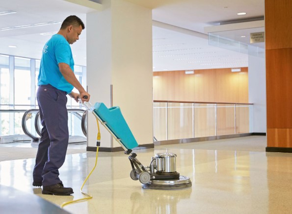 Man waxing floor