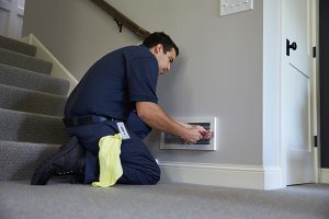 man cleaning air duct