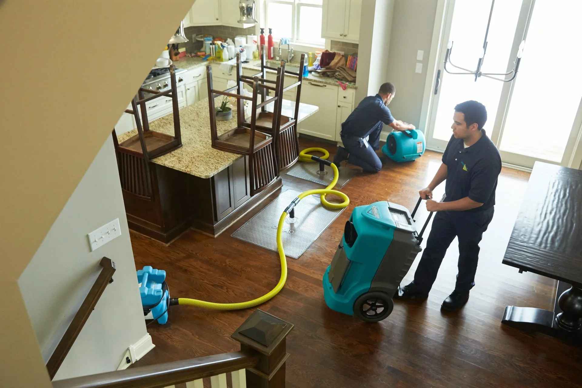 Two men cleaning a client house