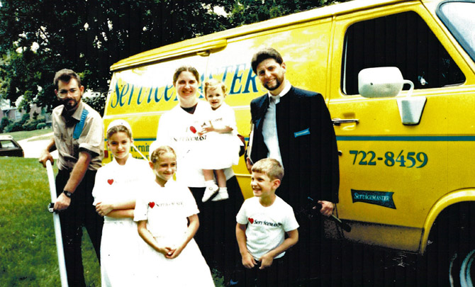photo of the Bender family in front of a Servicemaster van