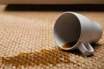 Coffee cup spilled on a carpet