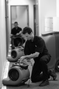 Man Using Restoration Fan