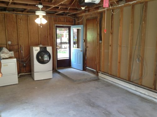 Empty garage with a washing machine