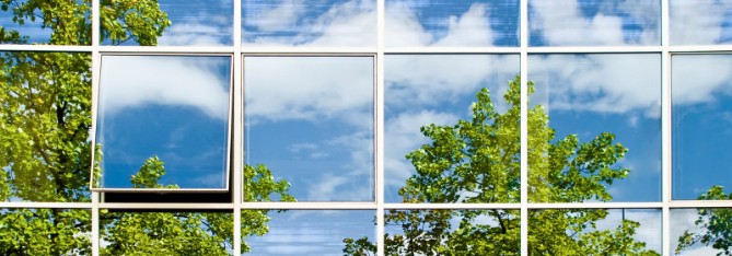 Windows with Image of Sky and Trees Reflected