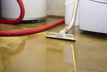 Cleaning Equipment Sitting in Water on Floor