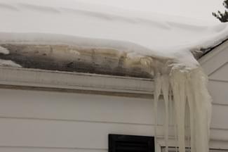 Ice dams on the roof of a home. 