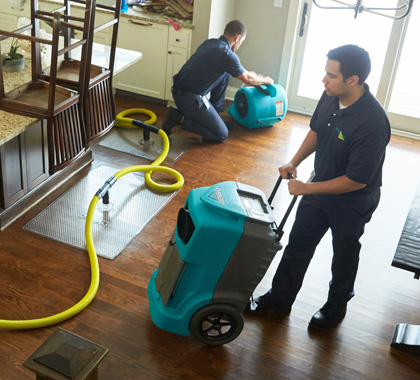 ServiceMaster Employees During Water Restoration in Kitchen