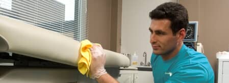 MAn cleaning an office