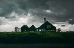 House with Storm Clouds Forming in the Sky