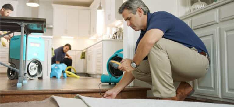 Man checking for water damage