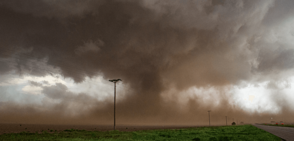 an Oklahoma tornado touches ground while dust is everywhere