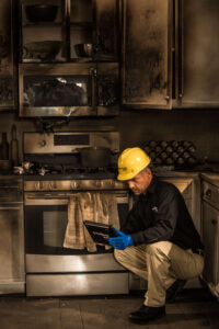 Service Master Technician assessing fire damage