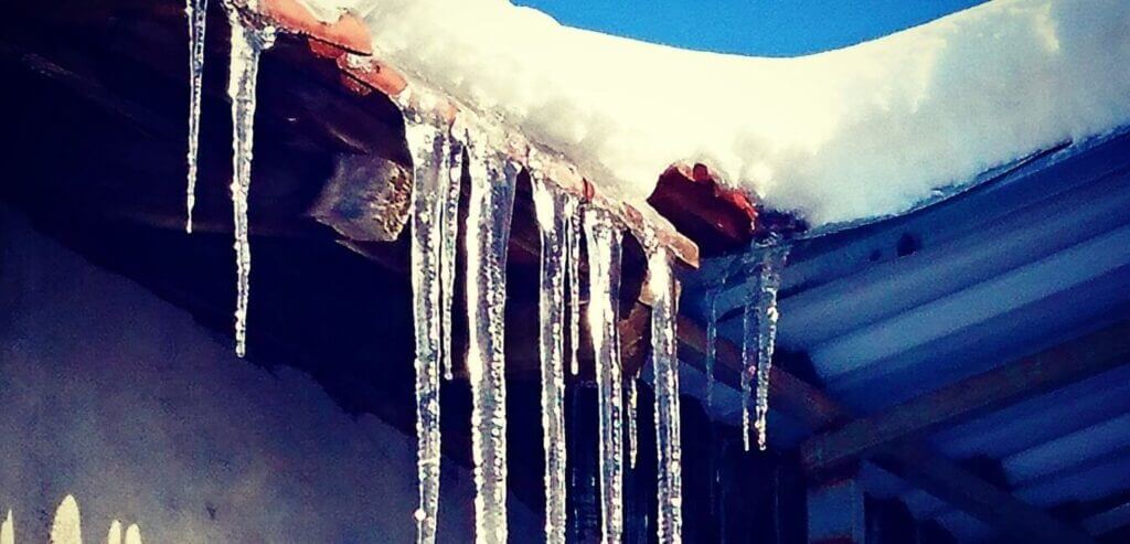 ice dam leaking in roof of house
