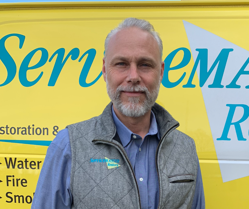 Ric Criscitello in front of a ServceMaster van