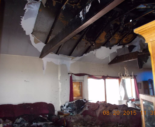 Destroyed room with exposed roof.